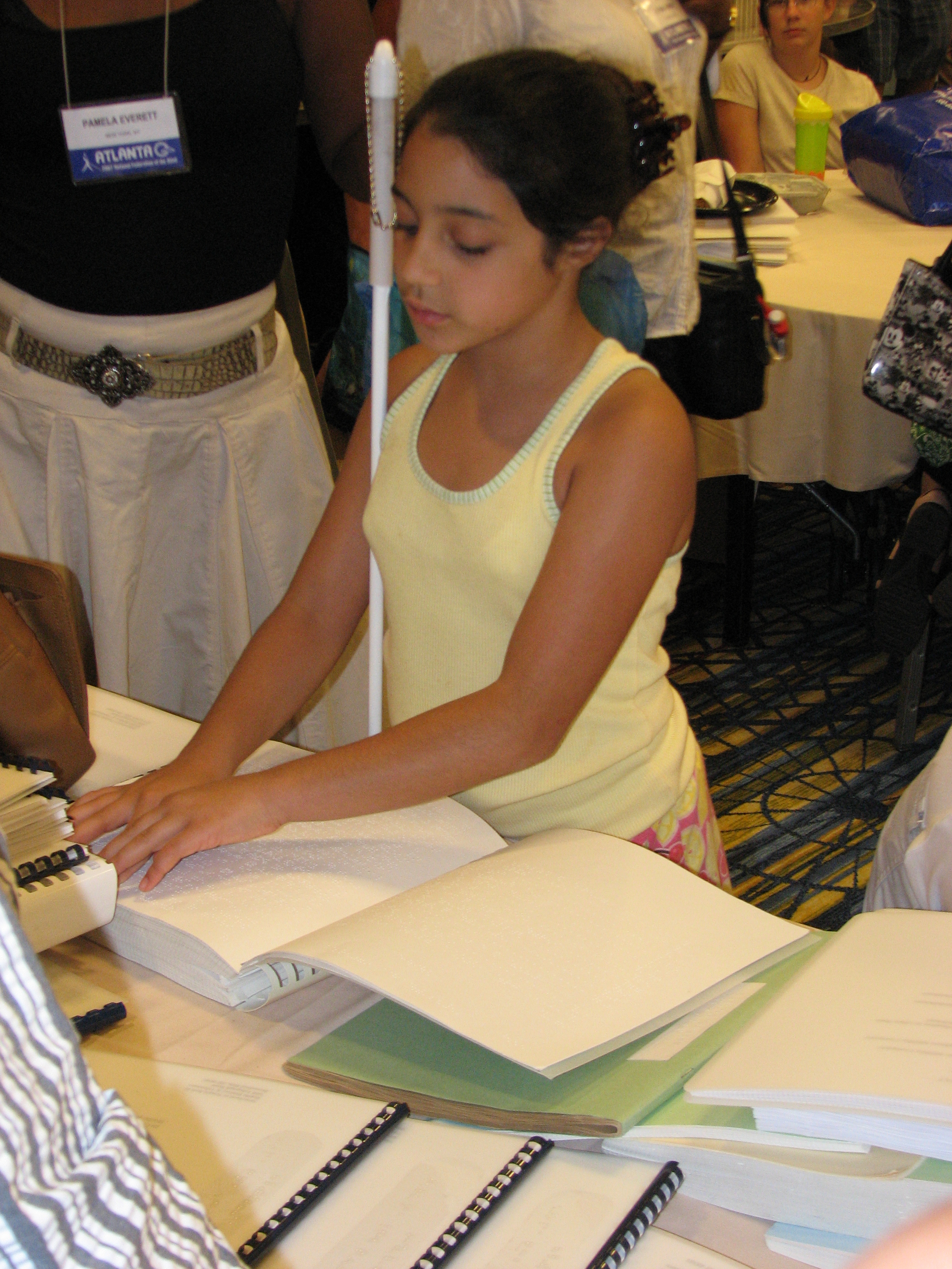 Child reading Braille